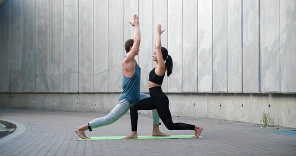 Young Attractive Couple Practicing Yoga Stretching Workout Outdoors Healthy Lifestyle Body Care