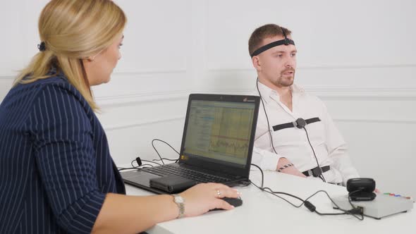 Guy Making a Polygraph Test