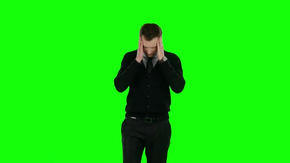 Businessman Holding His Head. Green Screen