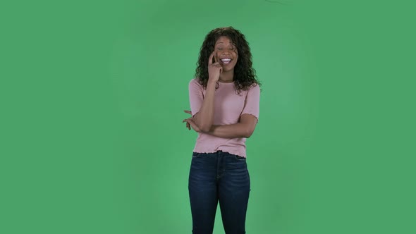 Portrait of Beautiful African American Young Woman Is Daydreaming and Smiling Looking Up. Burning