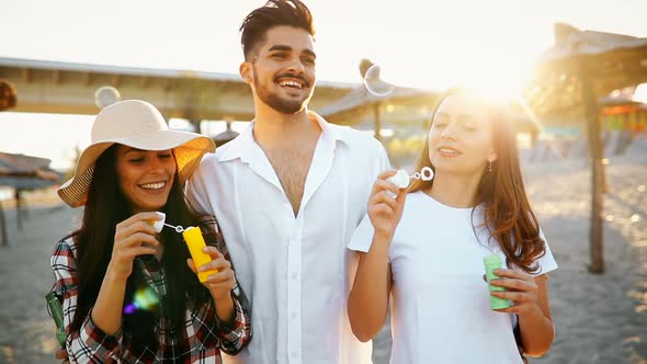 Group of Happy Young People Enjoying Summer Vacation