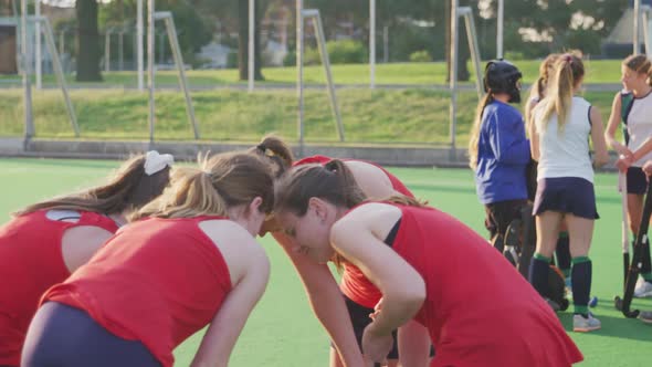 Female hockey players preparing match on the field