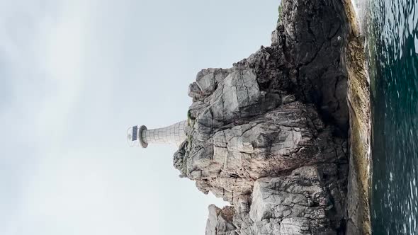 The view of Kolocep Lighthouse from the boat in Croatia.