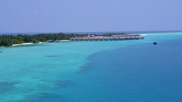 Drone seascape of tropical shore beach wildlife by blue ocean with sand background