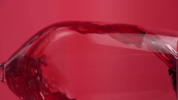 Vertical video, Close-up: red wine is poured into a glass