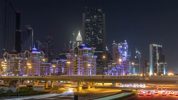 Car Traffic on Road Near Mall at Night in Downtown Timelapse