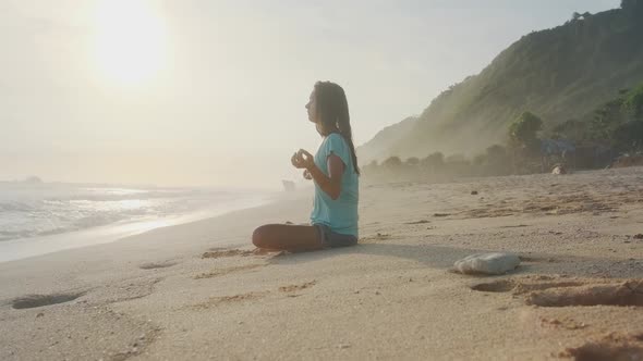 Calm Woman Relaxing Meditation No Stress Free Relief on Ocean Beach at Sunset