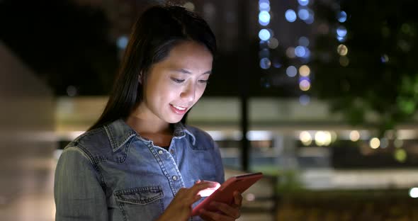 Woman Use of Mobile Phone in City