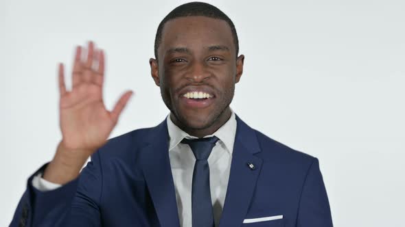 Welcoming African Businessman Waving, White Background