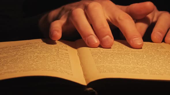 Reading an Old Book Under Atmospheric Yellow Lamp Lighting