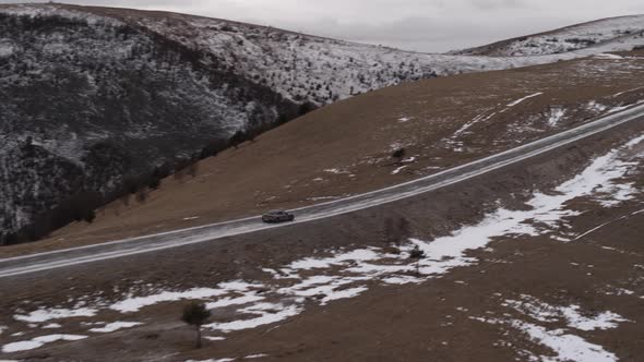 Car in the Mountains of the Caucasus in Winter