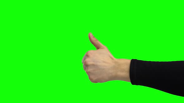 Arm of Male Showing Thumb Up. Chroma Key. Close Up