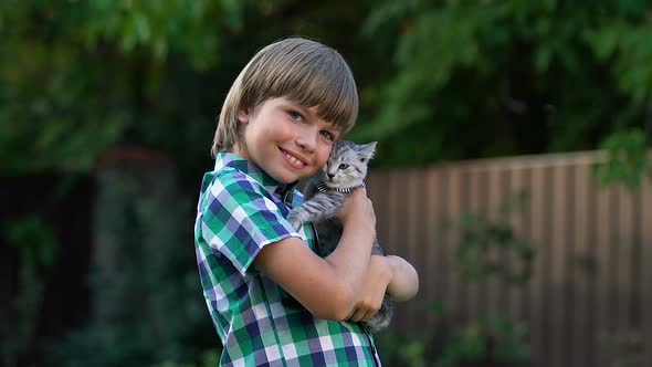 Happy Boy Hugging Little Kitten, Best Gift for Children, Tender Love for Animals