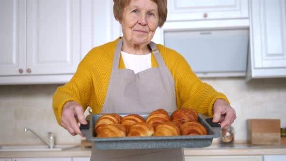 Senior Woman Cooking Pastry On Kitchen. Grandmother Making Tasty Baking.