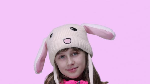 Girl Wearing Rabbit Hat with Moving Ears