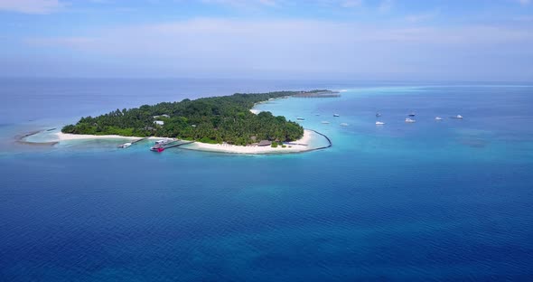 Natural aerial travel shot of a sunshine white sandy paradise beach and blue water background in col