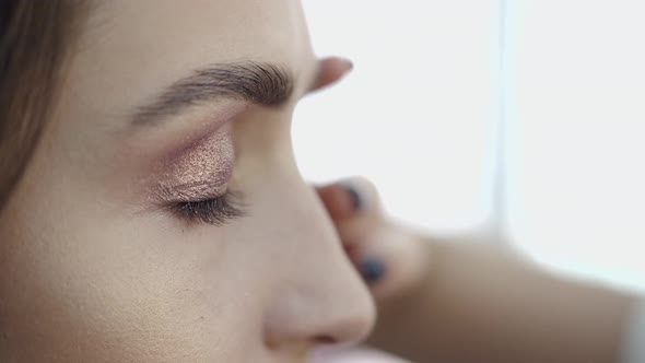 Cropped View of Girl's Face in Process of Doing Makeup