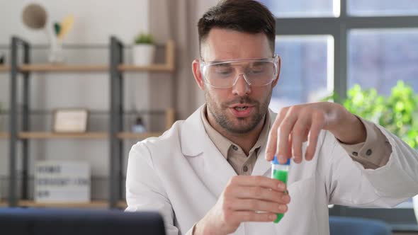 Chemistry Teacher with Laptop Having Online Class