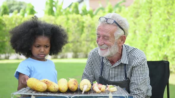 Family holiday activities with grandfather and grandchildren with camping.