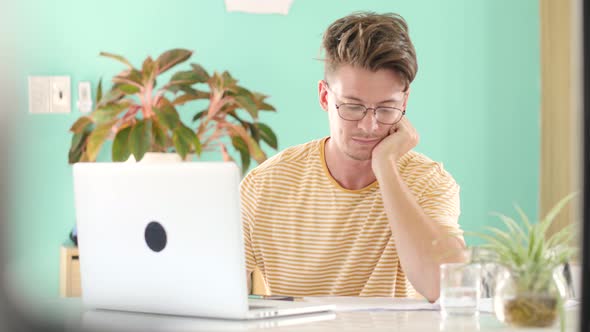 Close Up Focused Businessman Working on Laptop Computer in Home Office