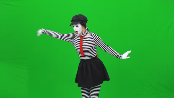 Mime Girl Found Flower, Sniffing, Sortilege on It. Chroma Key.