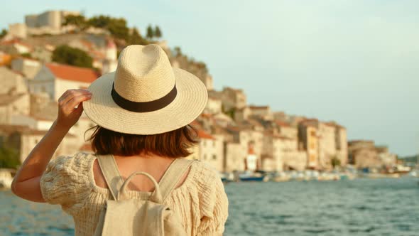 Young tourist looking at the sea on vacation