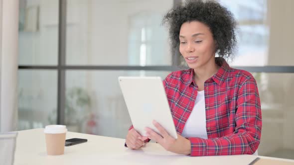 African Woman Making Video Call on Tablet