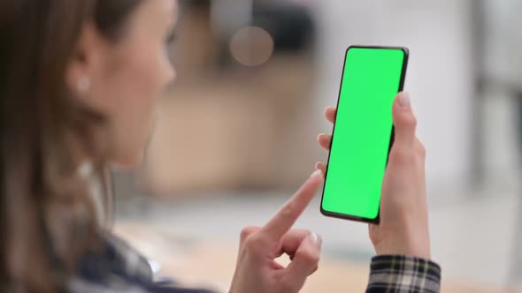 Female Watching Smartphone with Green Chroma Key Screen