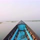 Old Blue Wooden Motor Boat Floats on the Calm River Water Surface Early Morning. Inle Lake, Myanmar - VideoHive Item for Sale