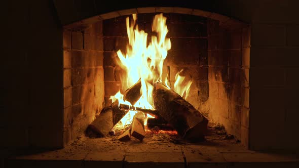 Burning Fire In The Fireplace. Wood And Embers In The Fireplace 