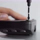 Unscrewing Small Screw with Screwdriver To Repair Battery Charging - VideoHive Item for Sale