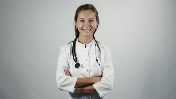 Female physician put on a stethoscope