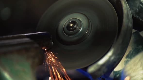 Professional Male Worker Works in Production with Metal