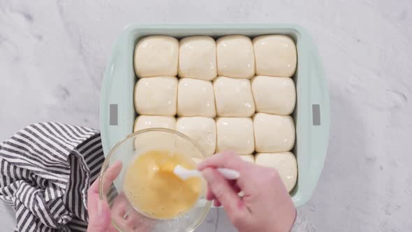 Flat lay. Preparing dinner rolls from the frozen dough in baking pan.