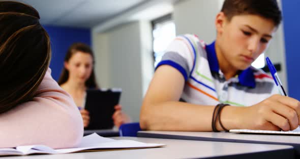 Tired student sleeping in classroom