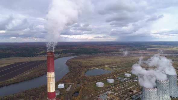 State District Power Station Aerial View. Steam Comes From a High Factory Chimney.