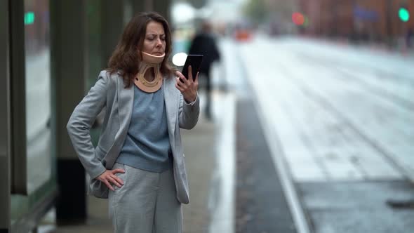 Portrait of an Adult Woman with a Medical Neck Brace To Treat a Neck Injury, Modern Lifestyle, She