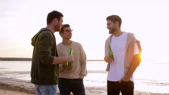 Young Men Toasting Non Alcoholic Beer on Beach