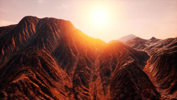 Sun Rays Over Mountains in a Valley