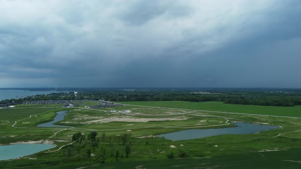 Aerial View Of Golf Course And Highway With Overcast In Port Dover, Ontario, Canada. wide