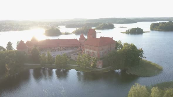 Flight Over Beautiful Trakai Castle at Sunset in Summer Season. Aerial View of Beautiful Castle on