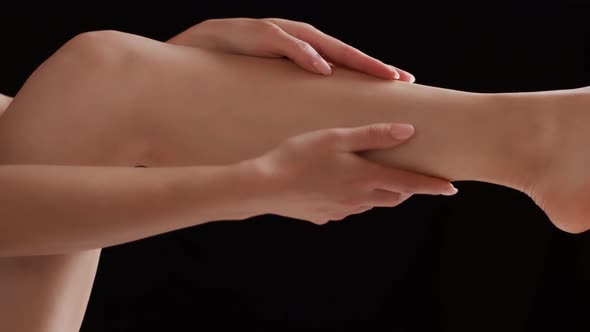 Woman Massaging Her Injured Leg Calf Muscle