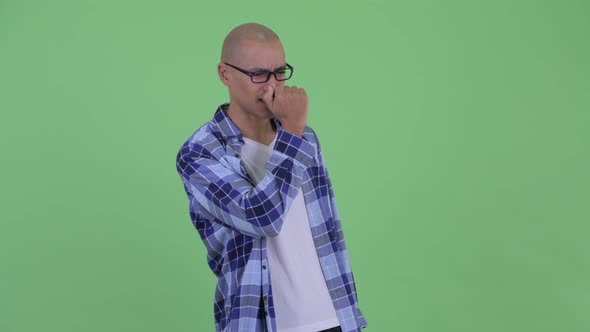 Stressed Bald Hipster Man Looking Around and Feeling Upset