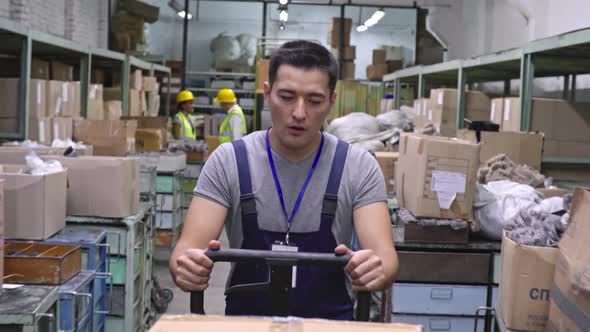 Male Worker with Warehouse Trolley