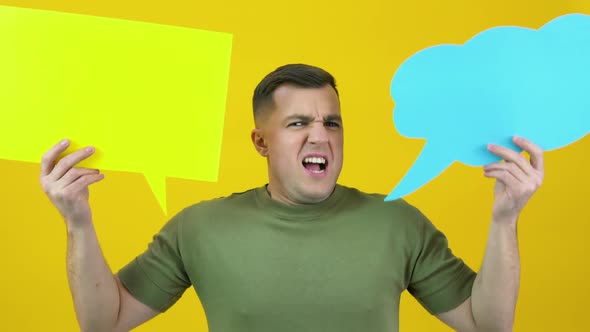 A Man Holds Two Backgrounds for the Insert Text and Shouts Loudly in the Frame