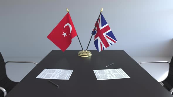 Flags of Turkey and the United Kingdom on the Table