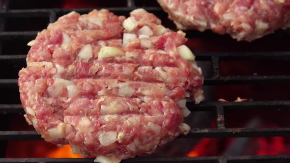 Closeup Panorama of Two Raw Homemade Burger Cutlets Made of Meat Roasting