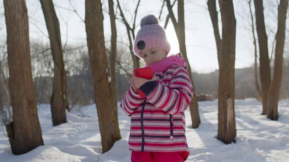 Children Kid Tourist Blogger Browsing on Mobile Phone Publishing New Photo Post on Social Media