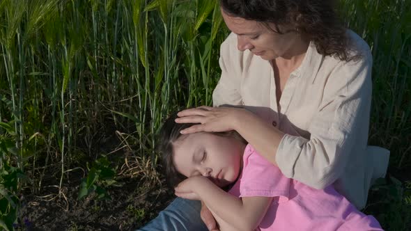 The daughter fell asleep in her arms.