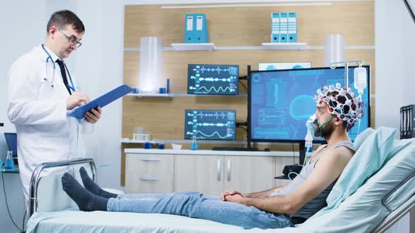 Doctor in Brain Activity Making a Study on Human Brain in a Neurology Centre